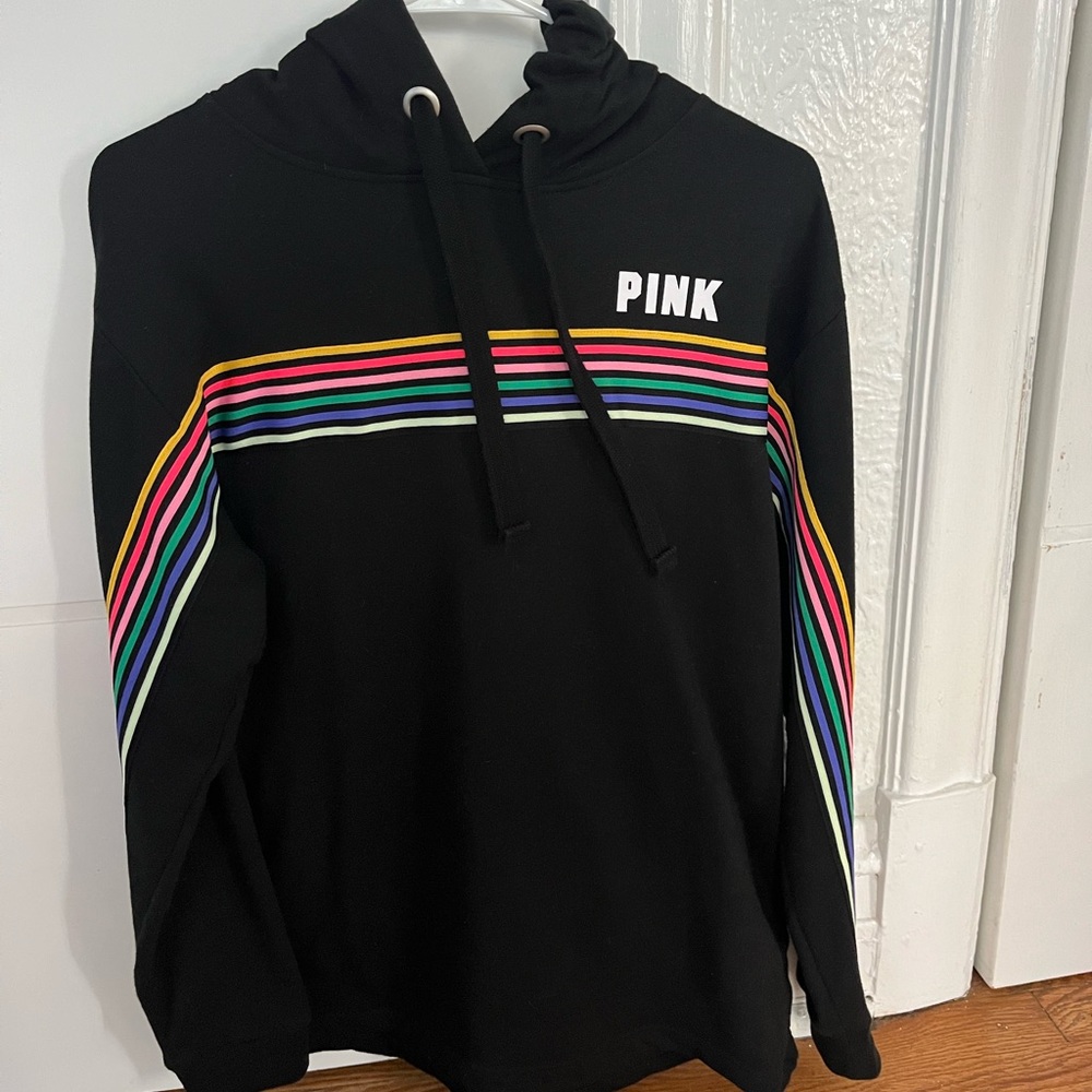 Pink black hoodie with multi color stripes.